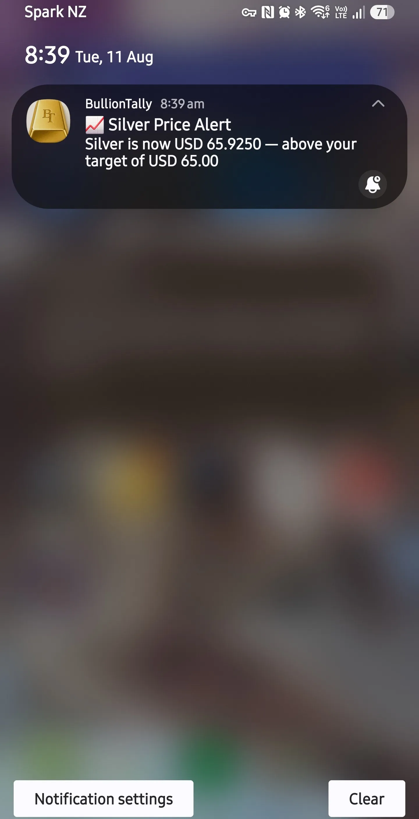 BullionTally silver price alert notification on a phone lock screen